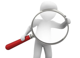 a person holding a magnifying magnifying magnifying magnifying