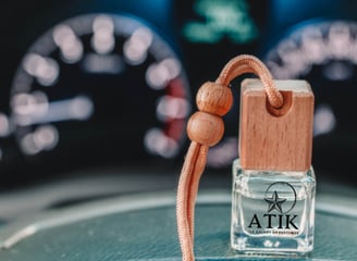 a bottle of refill air freshener for cars