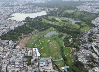 a cityscape of a golf course with a golf course