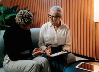 insurance agent shows info to a client