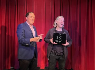 Bay Area mentalist David Martinez makes an on-stage helper laugh during a mentalist experience