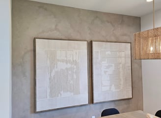 A soft, warm-toned limewash enhances the cozy elegance of this modern dining room in Phoenix.