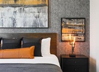 Elegant gray wallpaper accent wall in a modern bedroom, adding texture and sophistication to the space