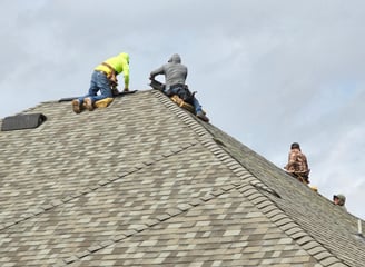 Sooner Construction Roofing Crew at Work put on a new shingled roof.