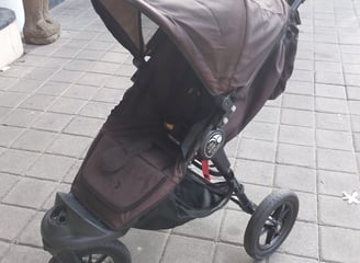 a stroller with a baby in a stroller