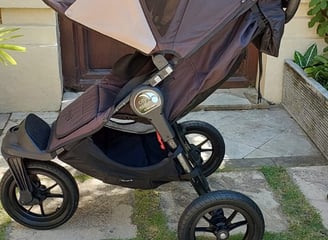 a baby stroller with a baby in a stroller
