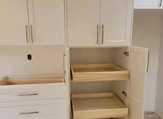 a kitchen with a pantry from kitchenrta with white cabinets and drawers