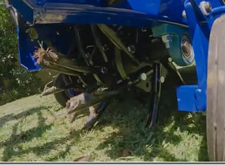 Fertilizer machine moving the dirt to get it ready for new growing process