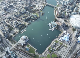 a cityscape of a city with a river and a bridge