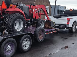 A tractor on a flatbed Trailer