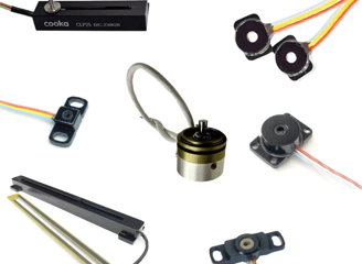 a collection of electronic components including a speaker and wires
