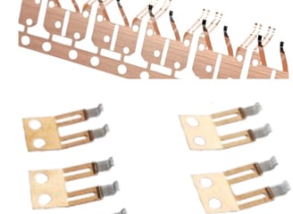a group of metal parts of a set of four different types of electrical components