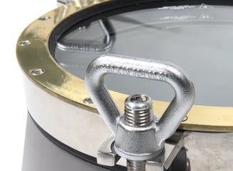Handle of a stainless and brass scuttle