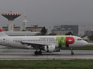 Portugal airlines- a plane with a colorful painted on it