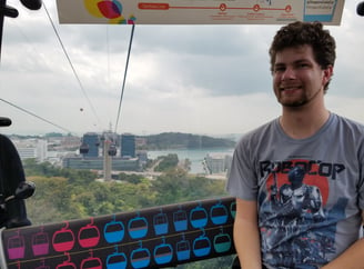 Steven enjoys the cable car ride over to Sentosa Island in Singapore