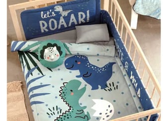 Cunero azul con estampado de dinosaurio modelo Rex de la marca Vianney