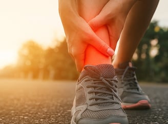 Common sports injury symptoms: swelling, pain, bruising, limited movement.