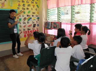 a teacher teaching children in a classroom