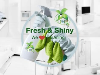 a person cleaning a kitchen with a cleaning cloth