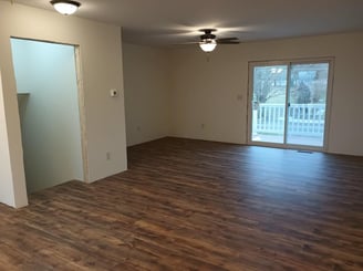 New vinyl laminate flooring was spread throughout this house in Goshen, IN, while being remodeled.