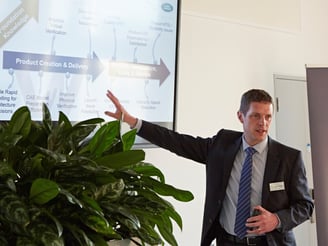 Steve Fannon presenting to an audience at a conference event.