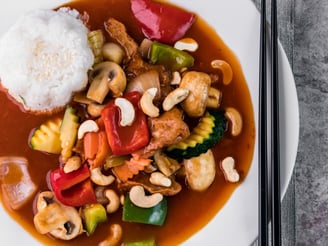 a plate of food with chopsticks