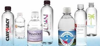 a variety of bottled water bottles with a variety of different types of water