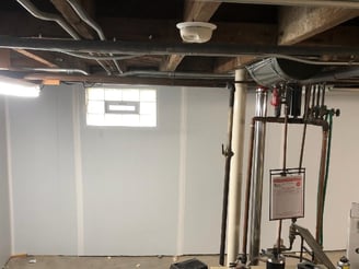 Spray foam insulation with drywall for paintable basement walls