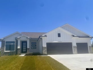 white ranch style home on Cooper St