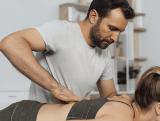 Physiotherapist at work on a woman using Meridian Muscle Reset (MMR) technique