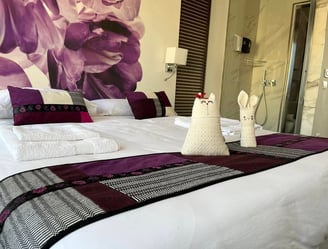 a bed with towels and towels on it