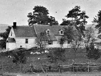 a black and white photo of the Roulette Farmhouse in Sharpsburg, MD. The Battle of Antietam