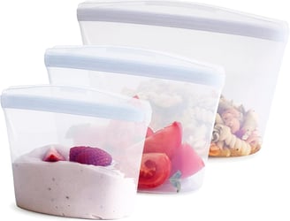 a variety of food items in a reusable silicone container