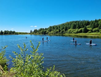 Paddle board lesson at Llyn Pendam