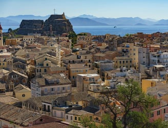 a cityscape of a large city with a view of the water