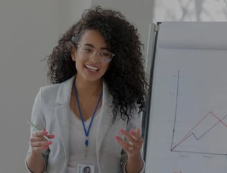 woman at a meeting showing growth strategy to clients