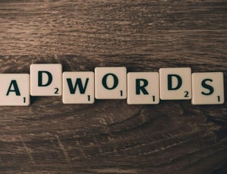 Adwords Tiles on Wooden Surface