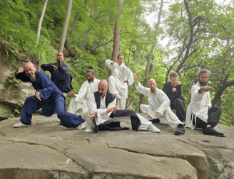 In the heart of nature, a Wudang family moves in harmony, weaving Tai Ji and Bagua into life.