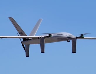 Fixed wing drone flying through the sky