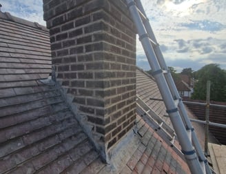 Chimney stack on roof repaired. Repointed brickwork