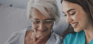 Home care personnel with elderly lady
