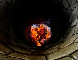 a fire pit with a fire in the middle of it