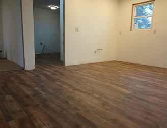 New vinyl laminate flooring was spread throughout this house in Goshen, IN, while being remodeled.