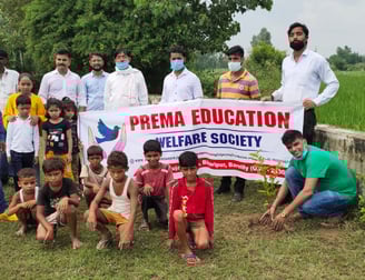 a group of people helping in tree plantation