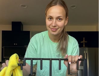 A professional cleaner thoroughly cleans the grill of stove