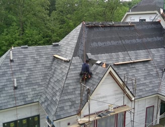 classic slate roof being installed on a new construction
