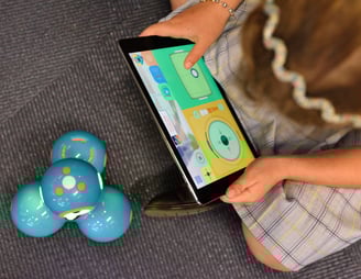 a child playing with a phone phone