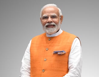 Narendra Modi in an orange vest and local dress