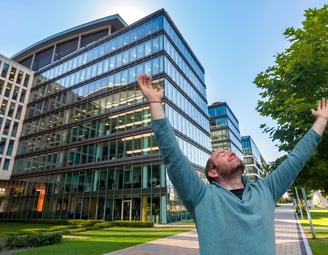 man with arms in the air