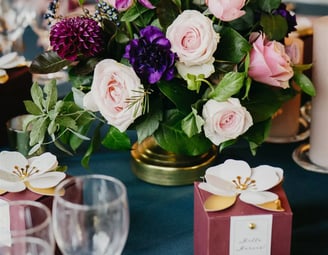 Luxury editorial wedding table detail with floral centerpiece in Provence